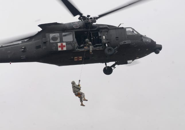 US Army Helicopter Hoisting a Soldier